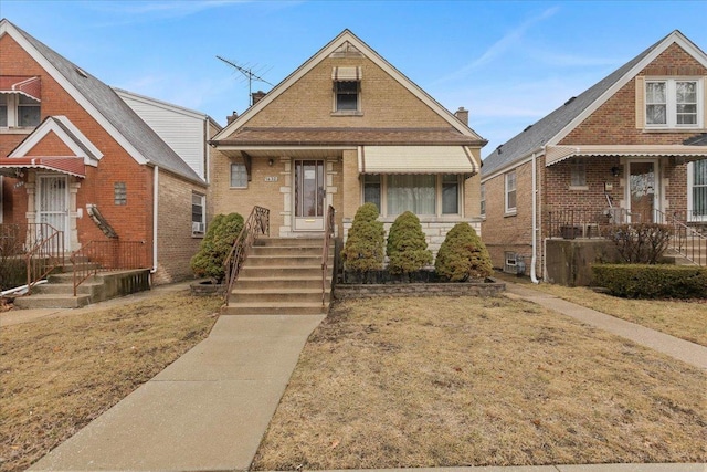 view of front of house with brick siding