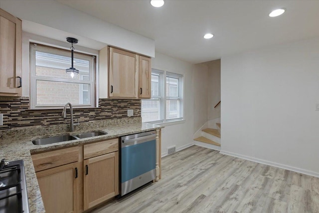 kitchen featuring visible vents, light brown cabinetry, a sink, backsplash, and dishwasher