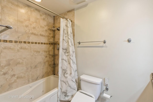 bathroom with visible vents, shower / bath combo, and toilet