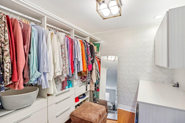 walk in closet featuring light wood-style floors