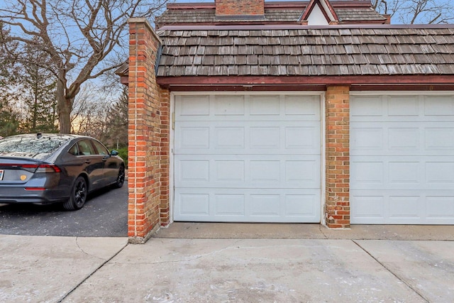 garage featuring driveway