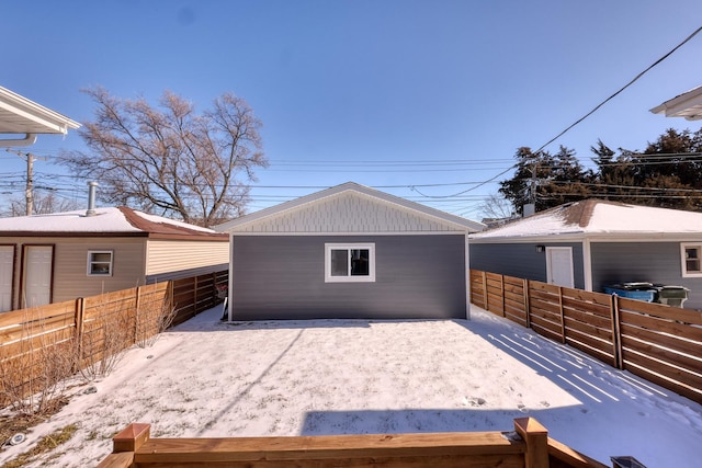 exterior space with fence and an outbuilding