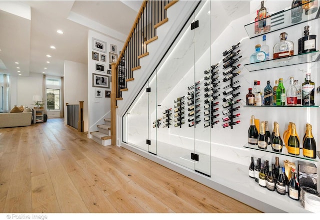 wine area with recessed lighting and hardwood / wood-style floors