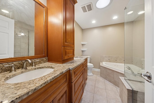 full bathroom with visible vents, toilet, a sink, tile patterned flooring, and a bath