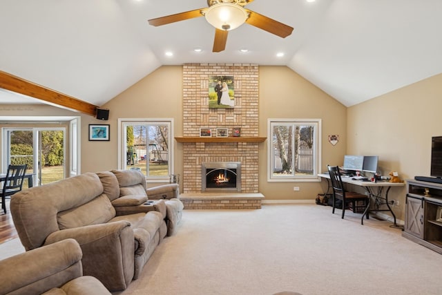 carpeted living area with ceiling fan, high vaulted ceiling, recessed lighting, baseboards, and a brick fireplace