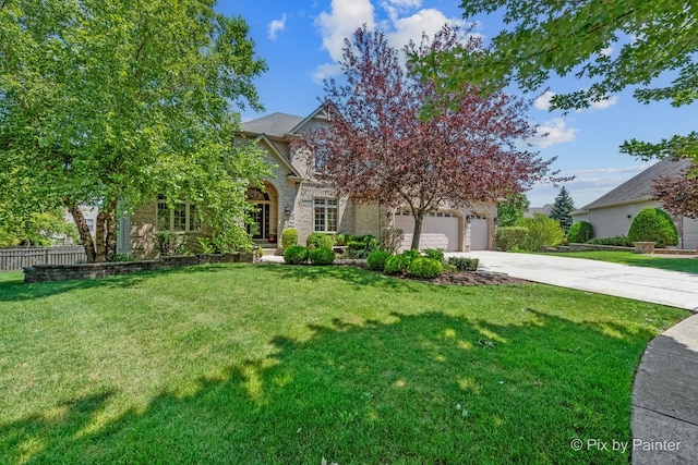 view of property hidden behind natural elements featuring a garage, stone siding, driveway, and a front lawn