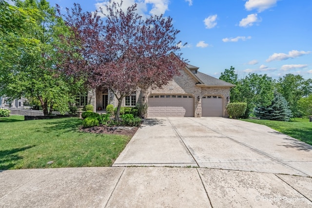 obstructed view of property featuring a front lawn, brick siding, driveway, and an attached garage