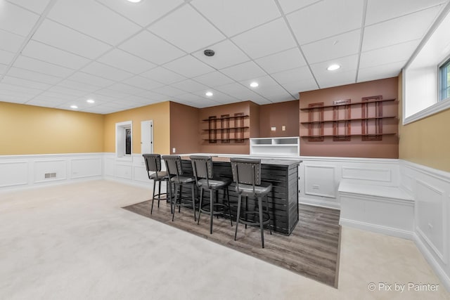 bar featuring a dry bar, a wainscoted wall, visible vents, and recessed lighting