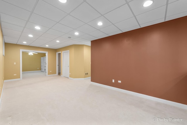 basement featuring recessed lighting, baseboards, ceiling fan, and light colored carpet