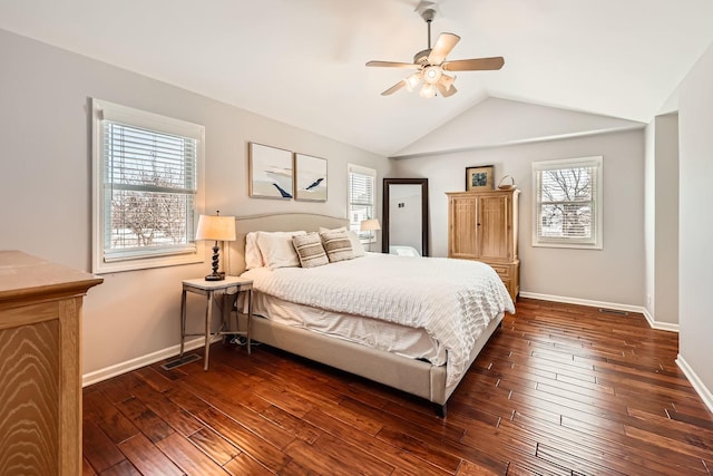 bedroom featuring vaulted ceiling, dark wood-style flooring, visible vents, and baseboards