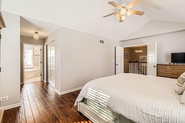 bedroom with dark wood-type flooring, visible vents, vaulted ceiling, and baseboards