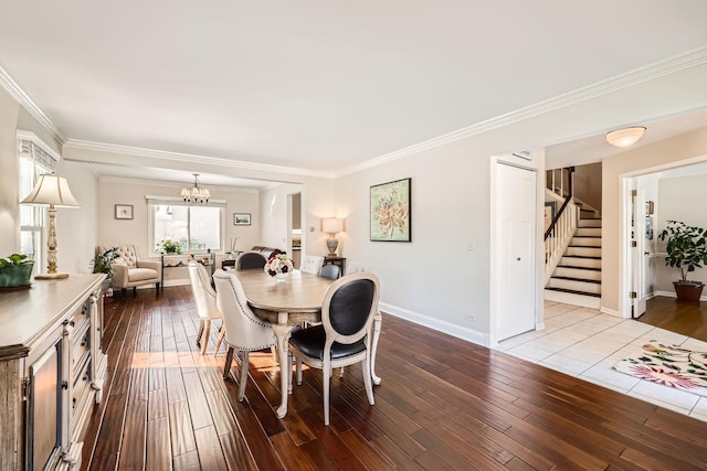 dining space with baseboards, stairway, an inviting chandelier, crown molding, and light wood-style floors