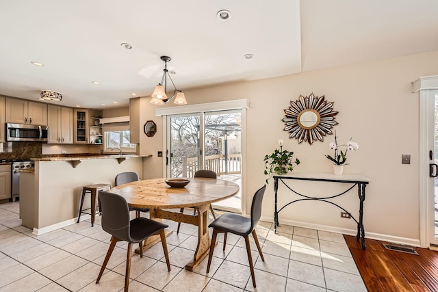 dining area featuring light tile patterned floors, recessed lighting, visible vents, and baseboards