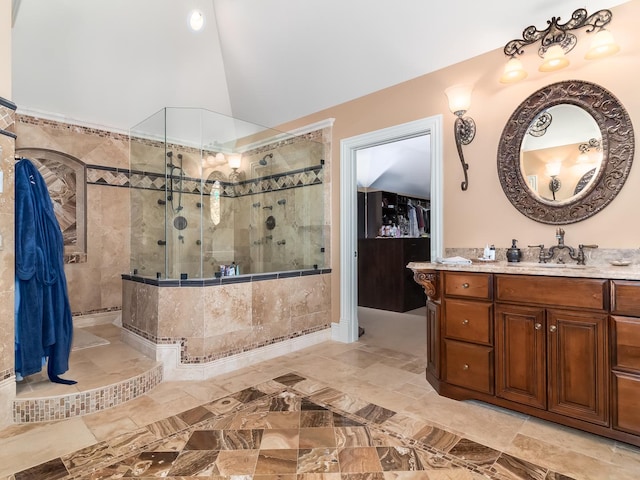 bathroom with a walk in shower, lofted ceiling, and vanity