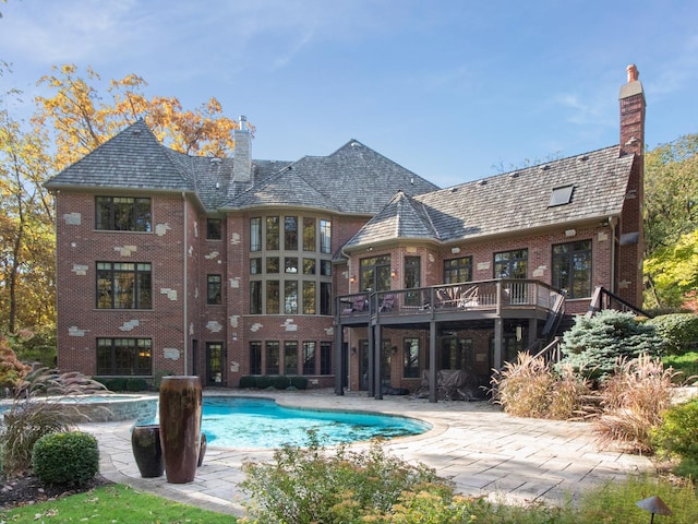 pool featuring a deck and a patio