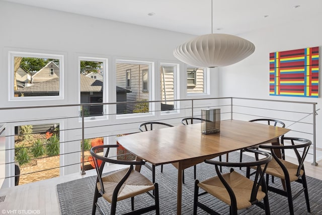 dining space featuring recessed lighting and wood finished floors