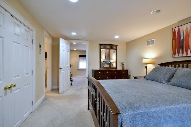 bedroom with light carpet, recessed lighting, visible vents, and baseboards