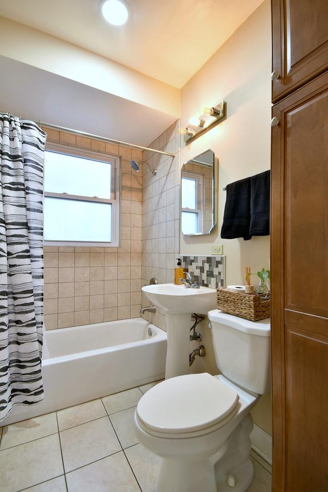 full bathroom with toilet, tile patterned flooring, decorative backsplash, and shower / bath combination with curtain