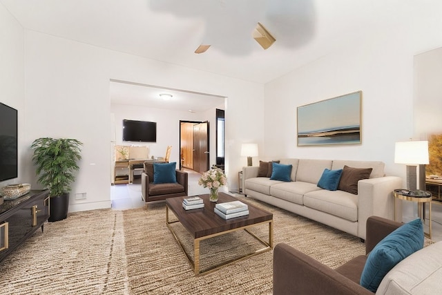 living room featuring a ceiling fan