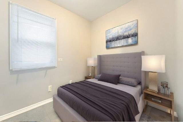 bedroom featuring baseboards