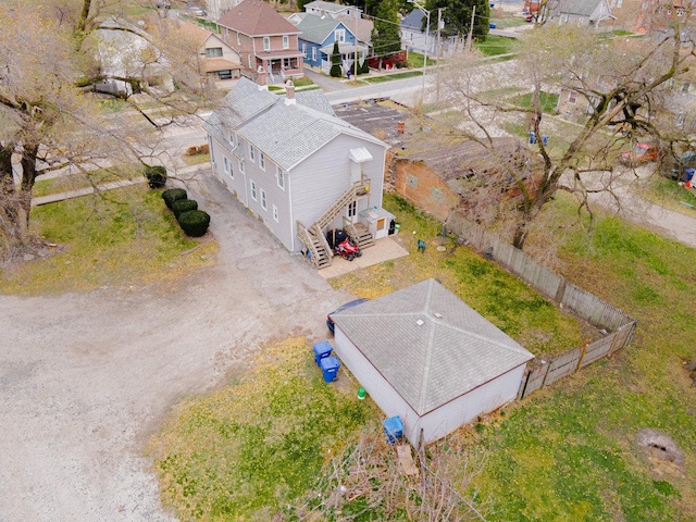 birds eye view of property with a residential view