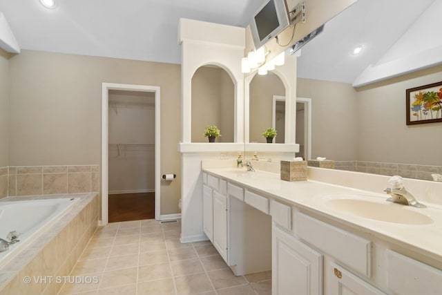 bathroom with lofted ceiling, double vanity, tile patterned flooring, and a sink