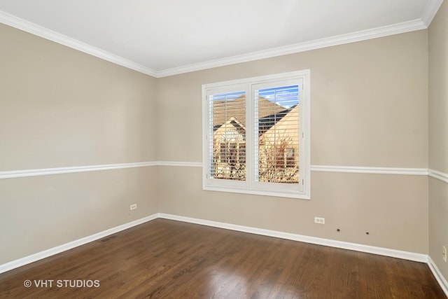 unfurnished room with ornamental molding, dark wood-type flooring, visible vents, and baseboards