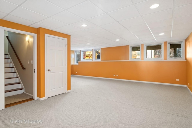 basement with recessed lighting, stairway, carpet, and baseboards