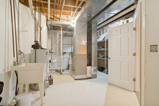 unfinished below grade area featuring gas water heater