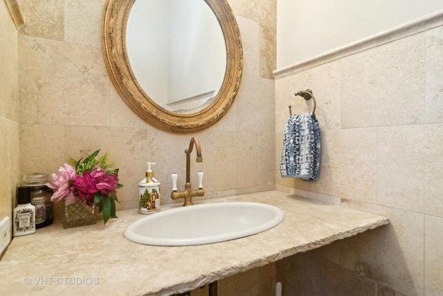 bathroom featuring tile walls and vanity