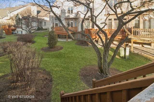 view of yard featuring a residential view and a wooden deck