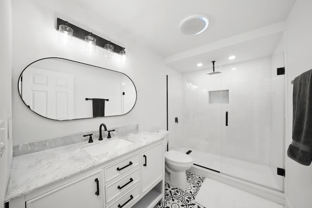 full bathroom featuring recessed lighting, toilet, a stall shower, vanity, and tile patterned flooring