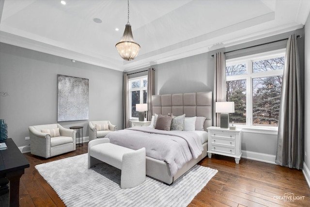 bedroom with baseboards, a raised ceiling, a chandelier, and dark wood-style flooring