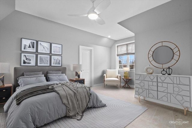 bedroom with vaulted ceiling, a ceiling fan, baseboards, and carpet floors