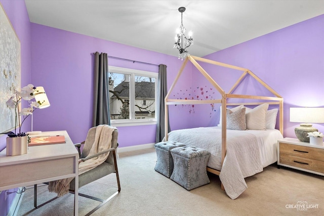 bedroom with a notable chandelier and carpet flooring