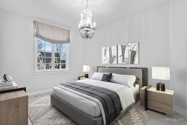 carpeted bedroom with visible vents, baseboards, and a chandelier