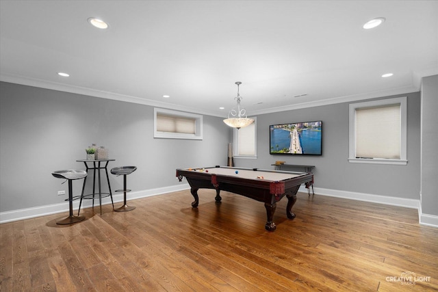 recreation room featuring crown molding, recessed lighting, wood finished floors, and baseboards