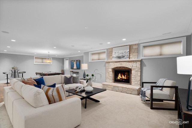 living area featuring a fireplace, carpet flooring, recessed lighting, and ornamental molding