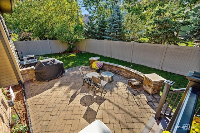 view of patio with a fenced backyard and grilling area