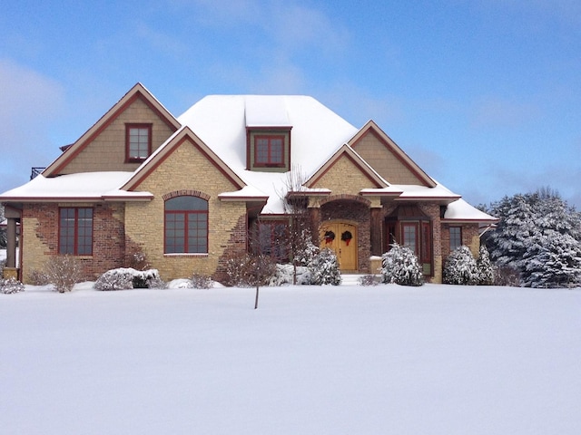 view of front of home with brick siding