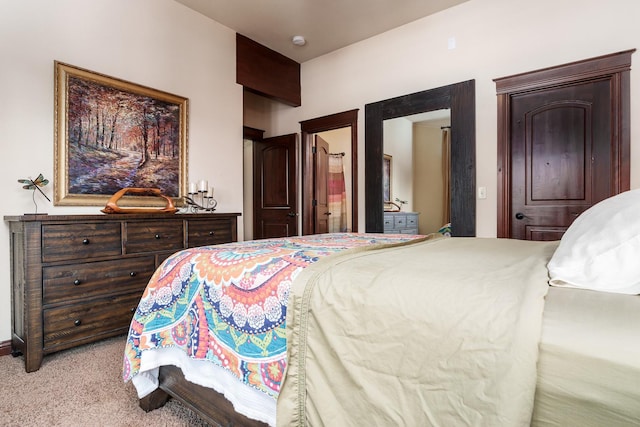 bedroom featuring light carpet