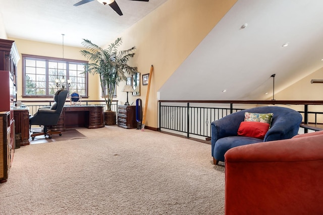 office area with light carpet, a ceiling fan, and baseboards