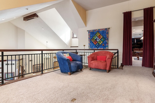 sitting room featuring carpet and vaulted ceiling