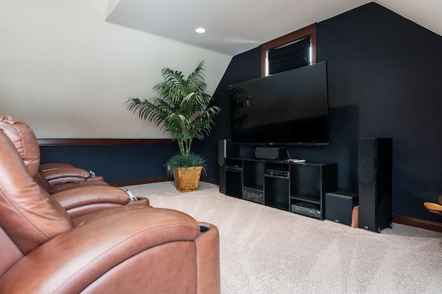 carpeted living room with vaulted ceiling and baseboards