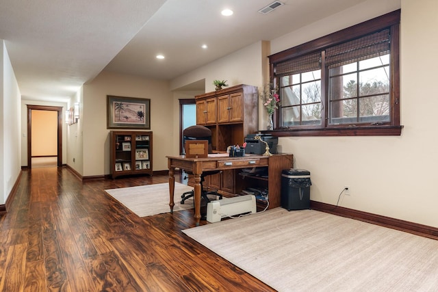 office space with dark wood-style floors, recessed lighting, visible vents, and baseboards