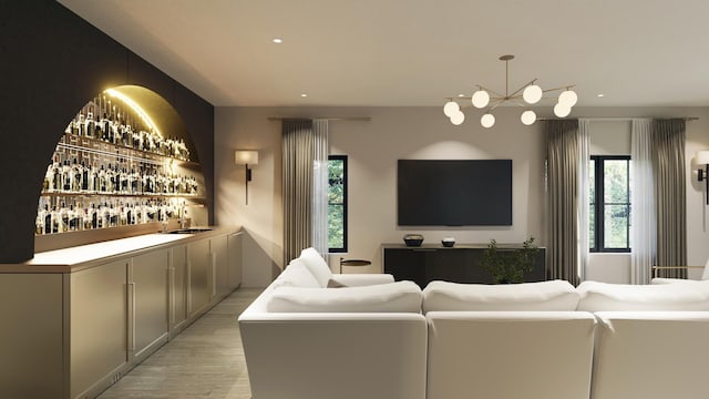 living room with an inviting chandelier, indoor wet bar, light wood-style flooring, and recessed lighting