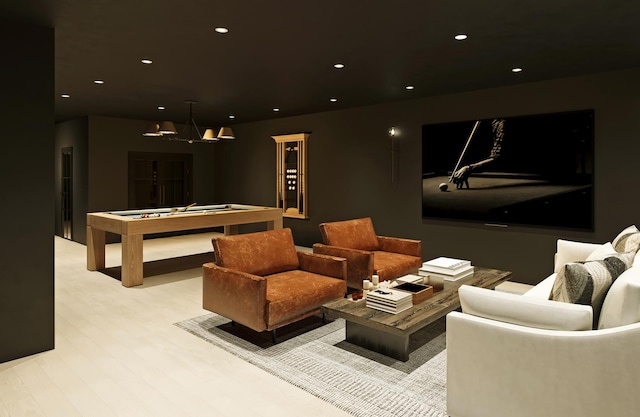 home theater featuring light wood-style floors, billiards, and recessed lighting