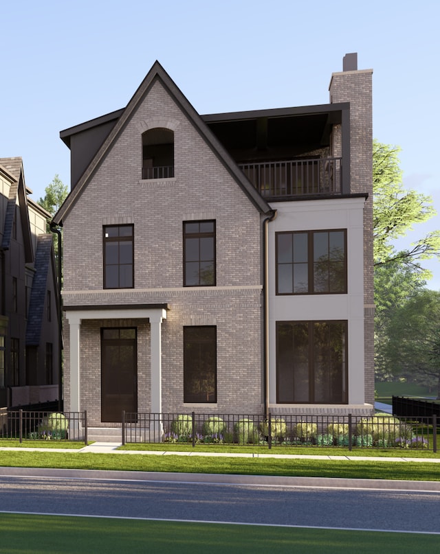 view of front of property featuring brick siding, a chimney, fence, and a balcony