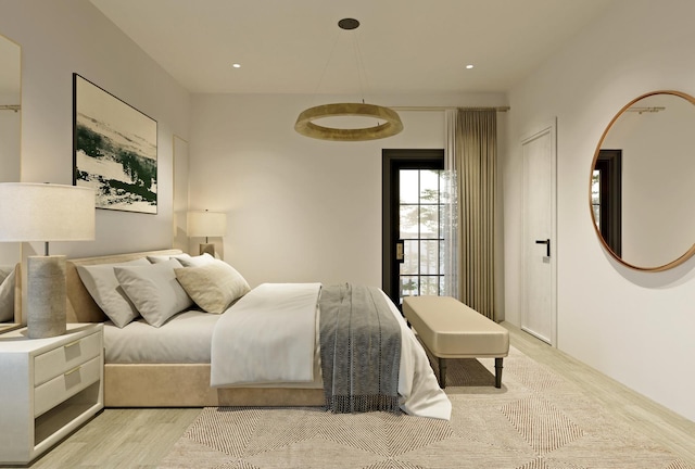 bedroom featuring recessed lighting and wood finished floors