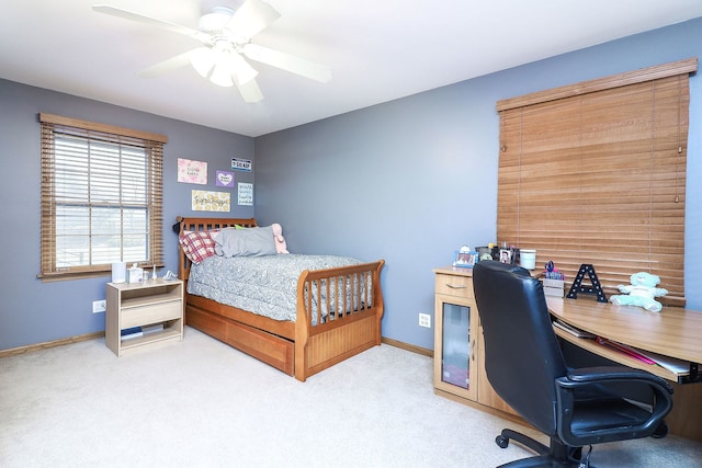 bedroom with a ceiling fan, baseboards, and carpet flooring